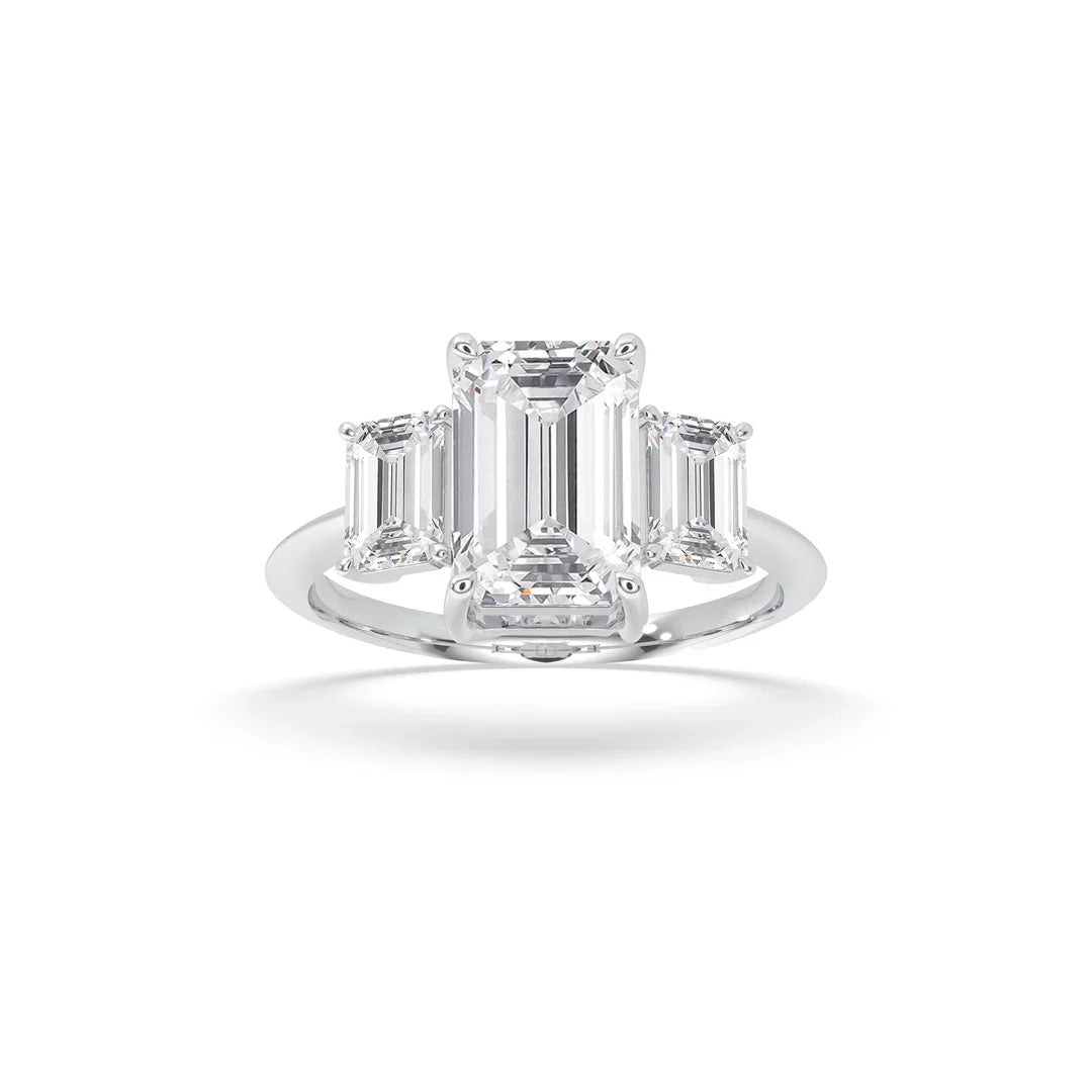 emerald cut three stone engagement rings