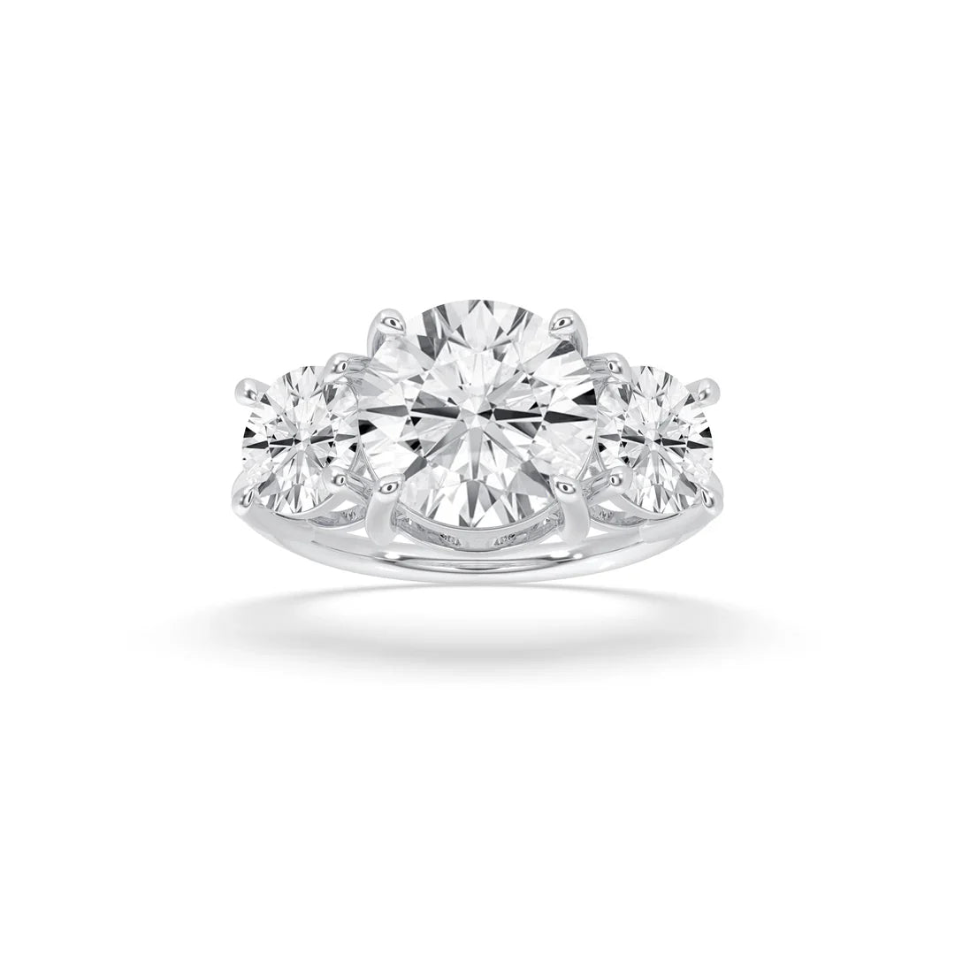 round cut three stone engagement ring